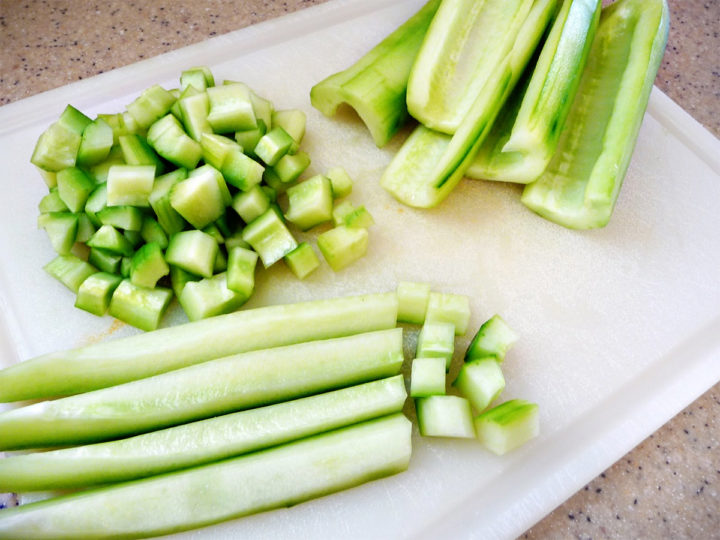 cucumbers being prepared for the recipe