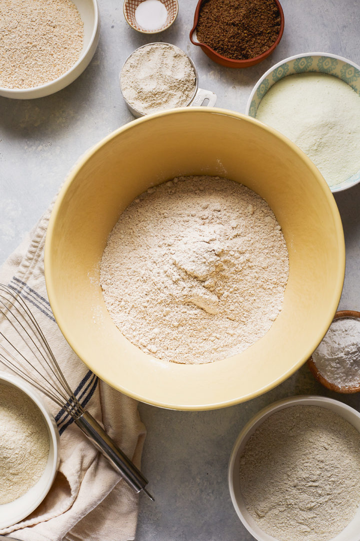 bowls of different types of flour used to make a multigrain pancake recipe