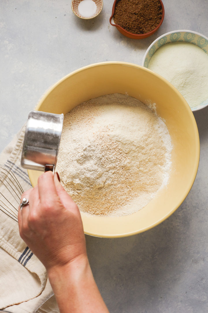 woman making a batch of multigrain pancakes