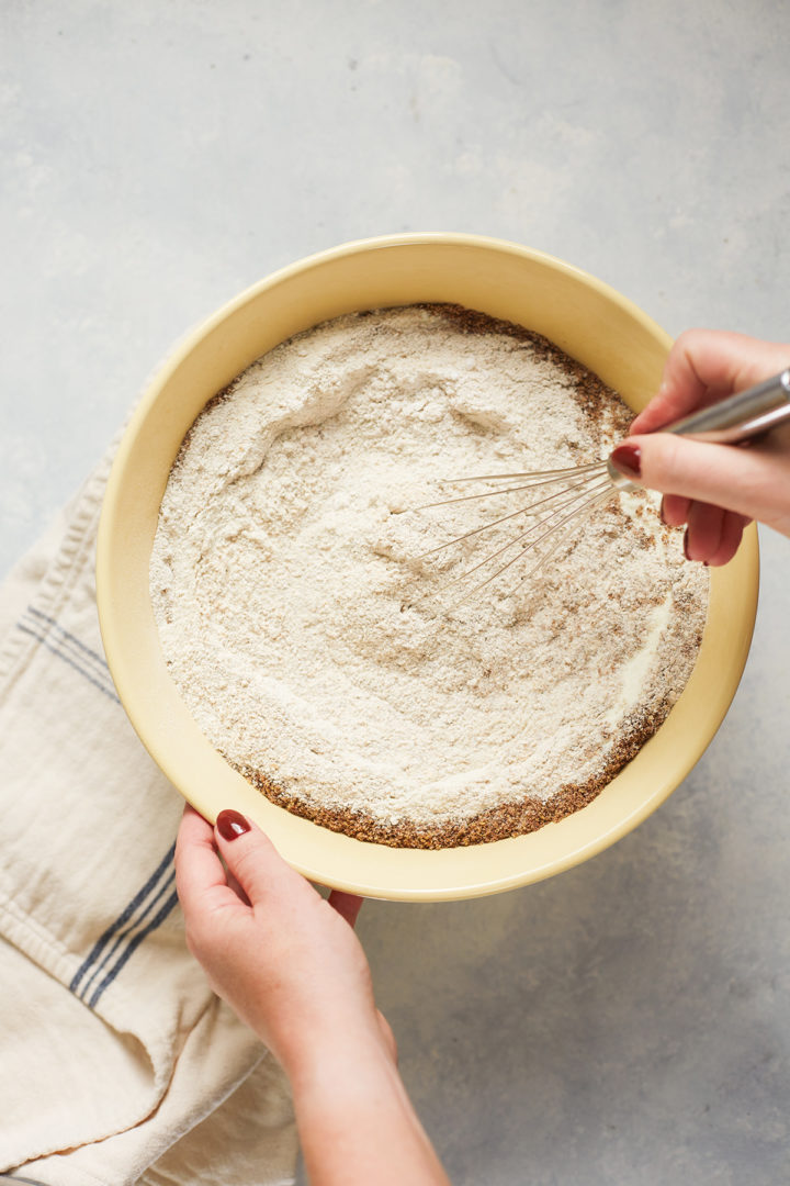 woman stirring ingredients for pancakes