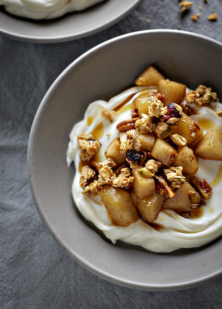 a bowl of pear compote with yogurt and granola