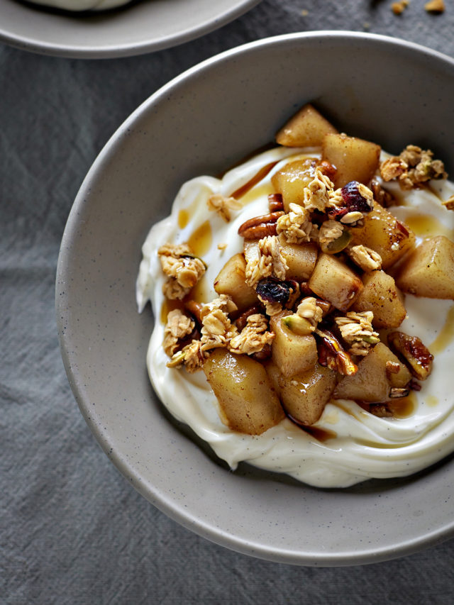 a bowl of pear compote with yogurt and granola