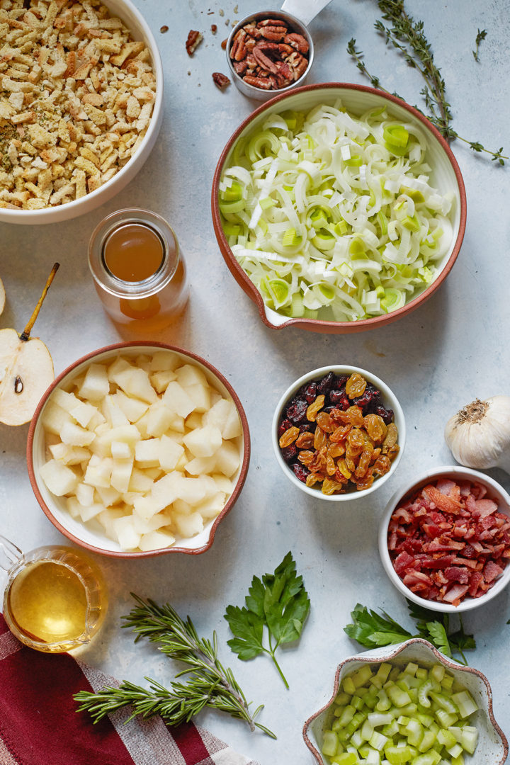 a bowl of freshly prepared leeks next bowls of other recipe ingredients