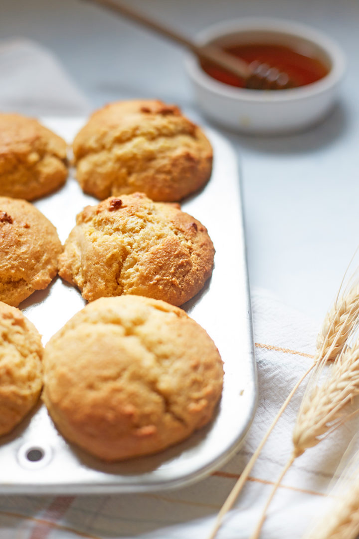 a pan of baked honey cornbread muffins