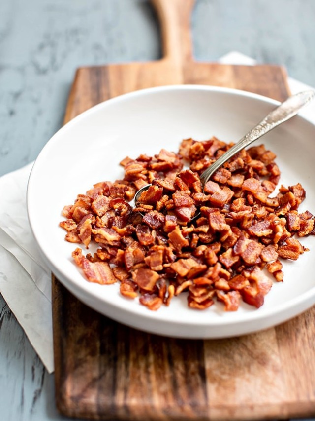 bowl of cooked bacon on cutting board