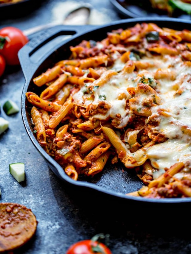 Easy One Skillet Baked Ziti is the perfect, easy comforting pasta dish - and baking it in a single skillet makes for quick preparation and very minimal clean up. Perfect for a weeknight dinner!