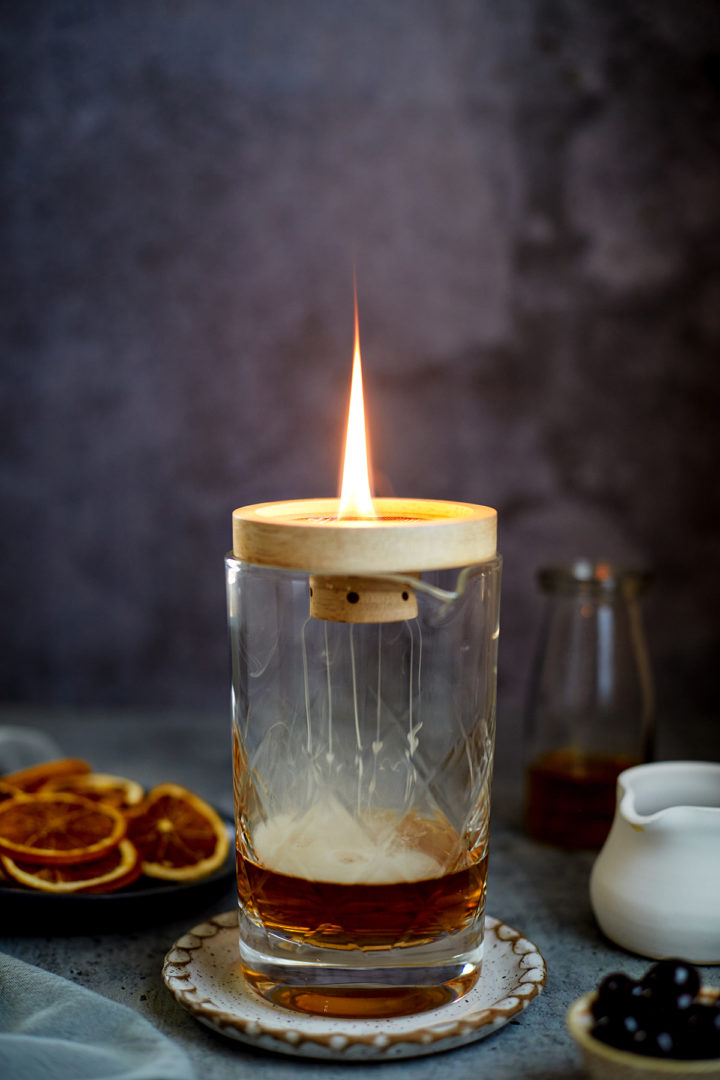 smokey old fashioned in a cocktail mixing glass