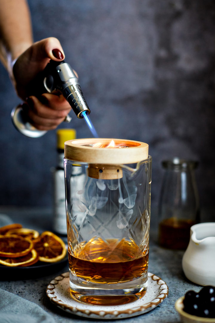 woman showing how to make a smoking drink	