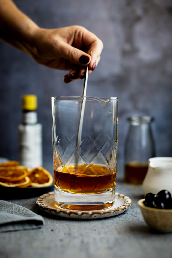 woman stirring an old fashioned