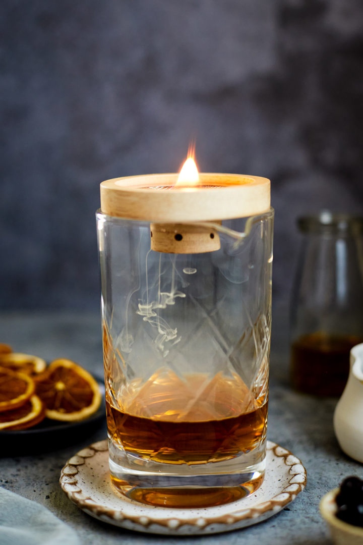 cocktail mixing glass with smoked old fashioned