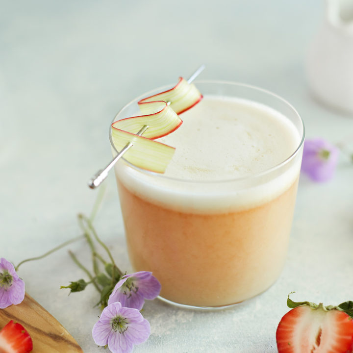 strawberry rhubarb whiskey sour in a glass