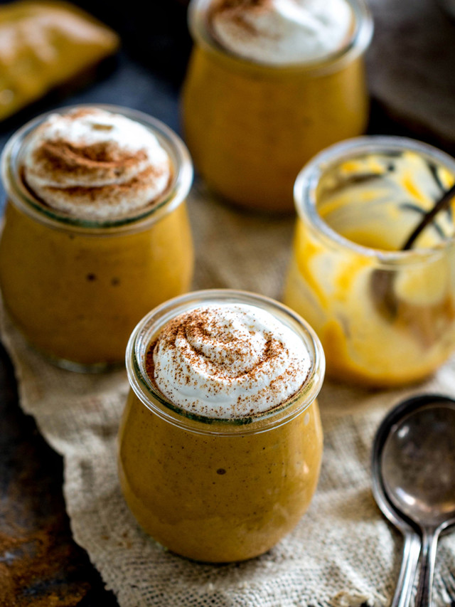 photo of pumpkin pudding in jars with whipped cream