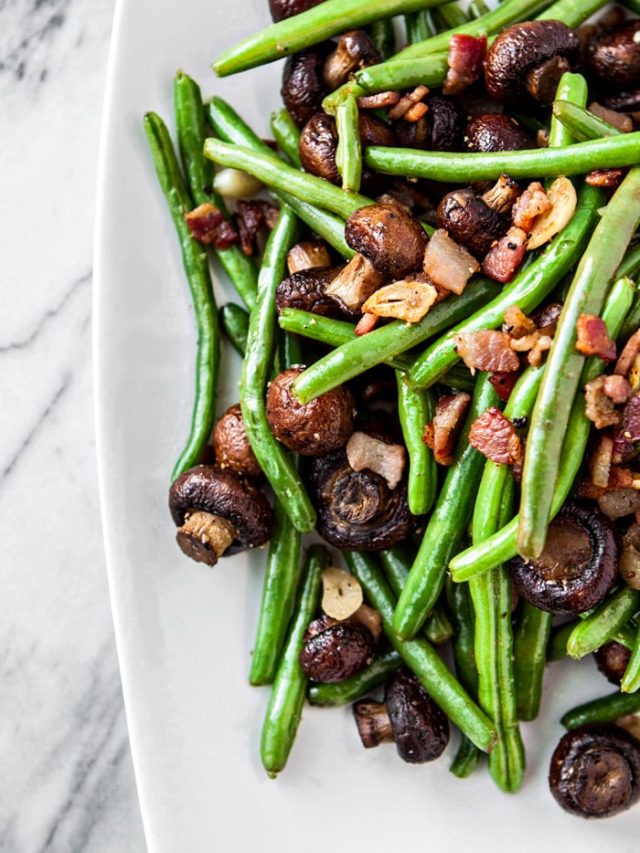 Garlic Bacon Sautéed Green Beans with Roasted Mushrooms make a great Thanksgiving side dish, loaded with flavor, and a lot fretting tasting than the traditional green bean casserole.