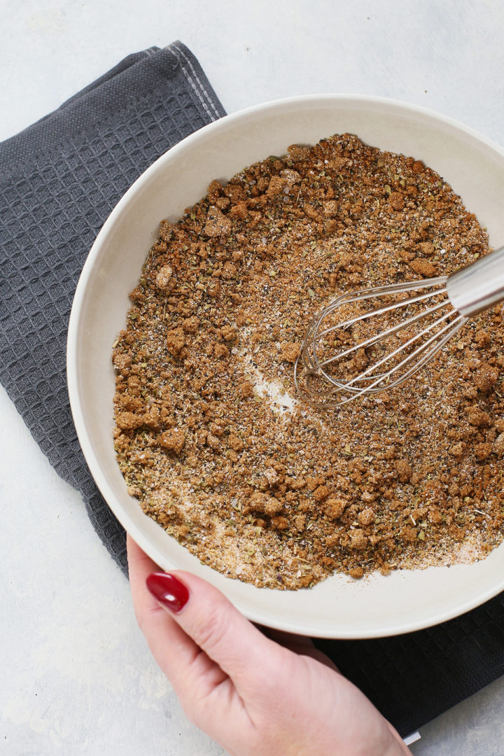 woman mixing the smoked pulled pork seasoning