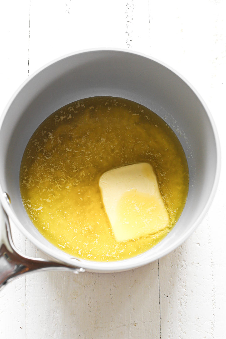 Butter melting in a saucepan on the stovetop, ready for making brownies.