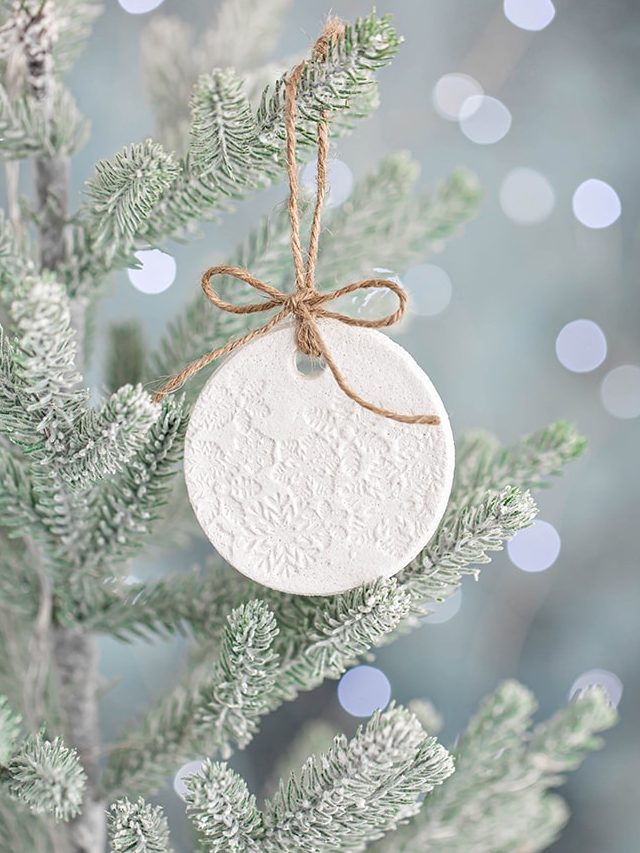 salt dough ornament on a christmas tree with lights