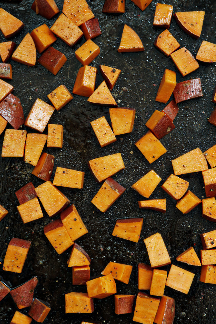 cubed sweet potatoes on a roasting pan