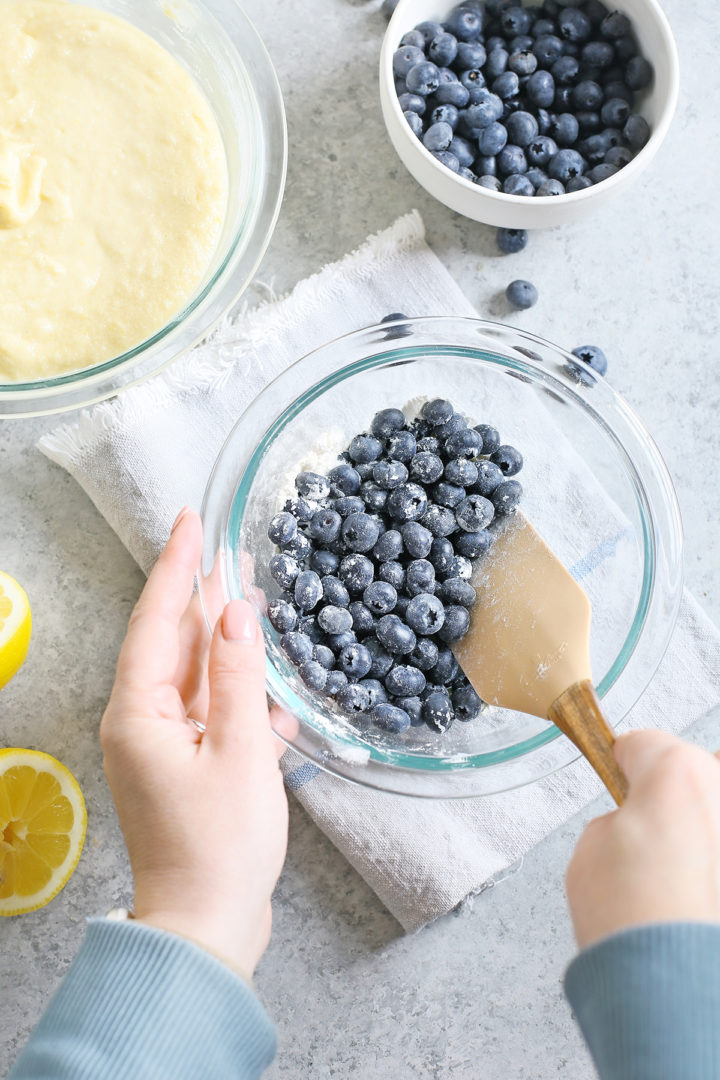 woman demonstrating a troubleshooting technique for baking with frozen blueberries