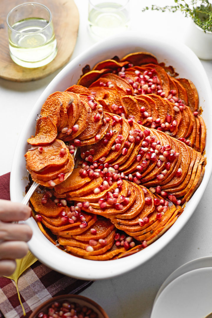 woman serving thanksgiving sweet potatoes