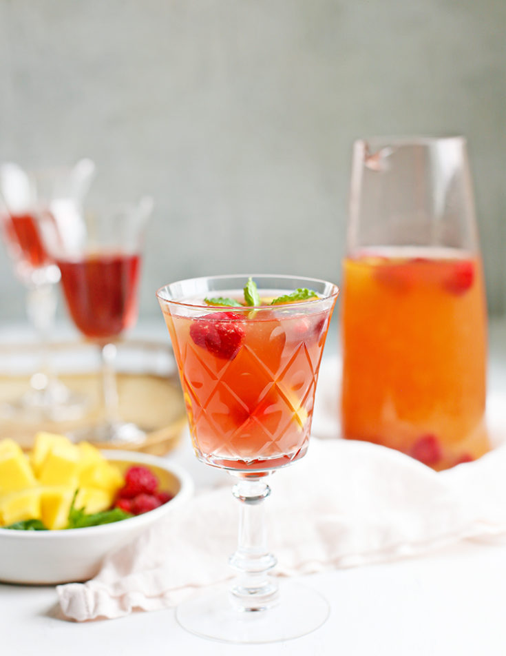 https://www.goodlifeeats.com/wp-content/uploads/2022/06/Recipe-Mango-Raspberry-Rose%CC%81-Sangria-735x952.jpg