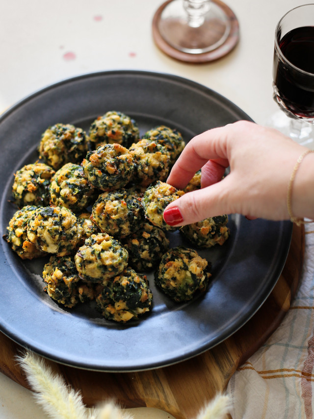 photo of woman with a plate of spinach balls