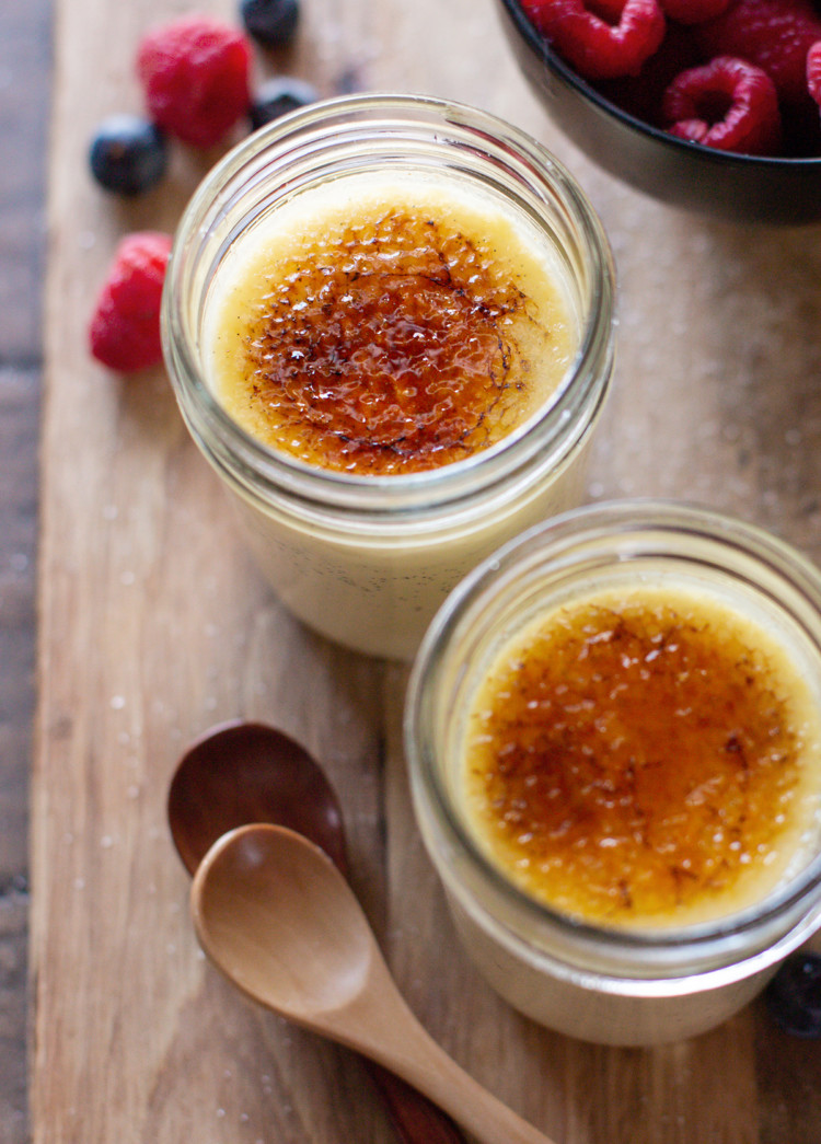 photo of 2 jars of sous vide creme brulee with fresh berries