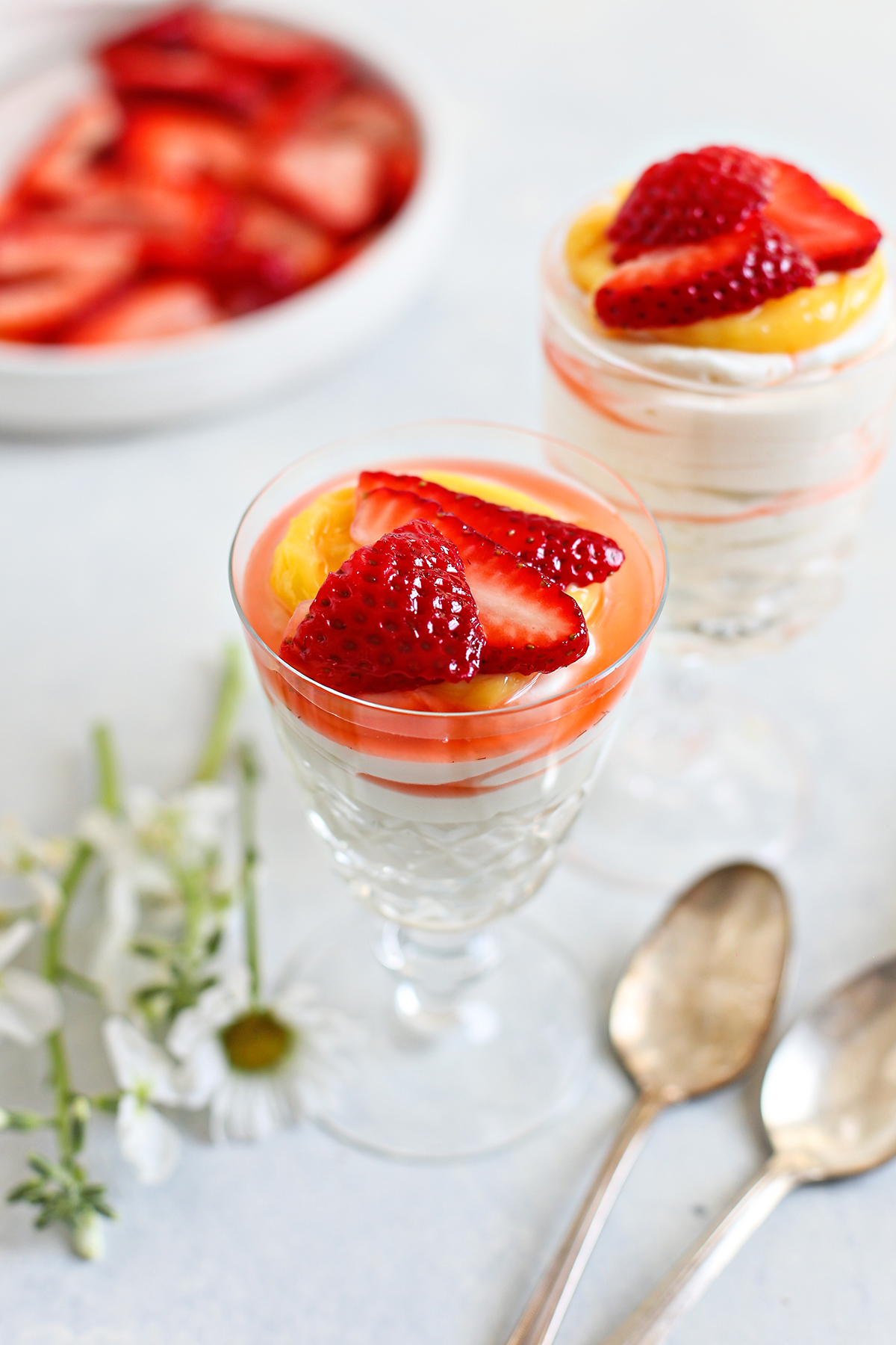 https://www.goodlifeeats.com/wp-content/uploads/2023/04/Cheesecake-Mousse-with-Strawberries-and-Lemon-Curd.jpg