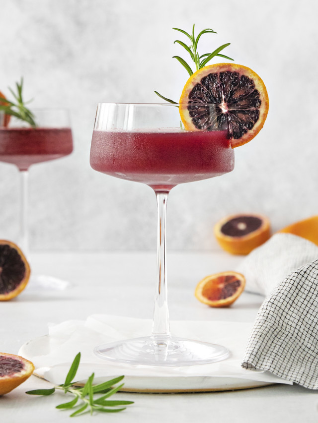 blood orange whiskey sour close up in a coupe glass