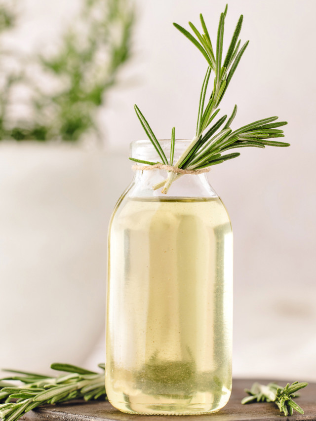 simple syrup with rosemary in a glass bottle