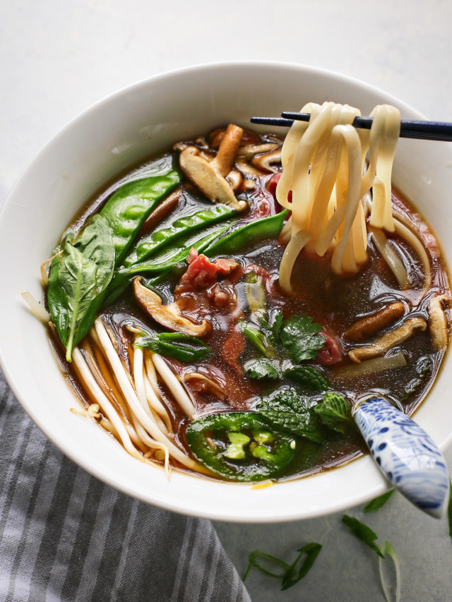 Vietnamese beef noodle soup in a white bowl