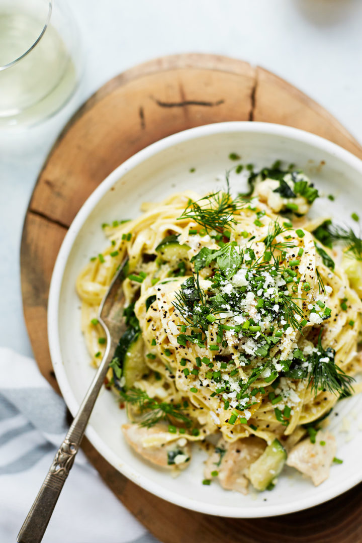 chicken pasta primavera in a white bowl