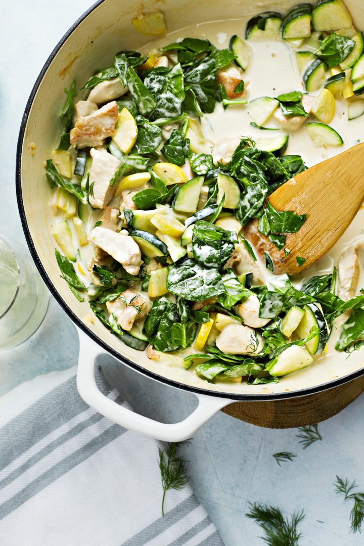 cooking the chicken pasta primavera in a pan