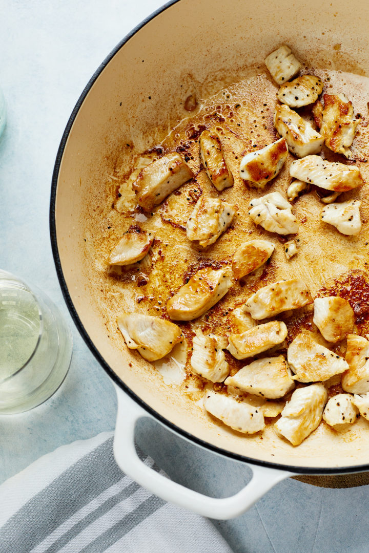 chicken cooking in a pan for pasta primavera 