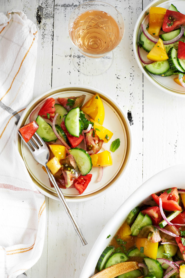 plates of cucumber tomato onion salad