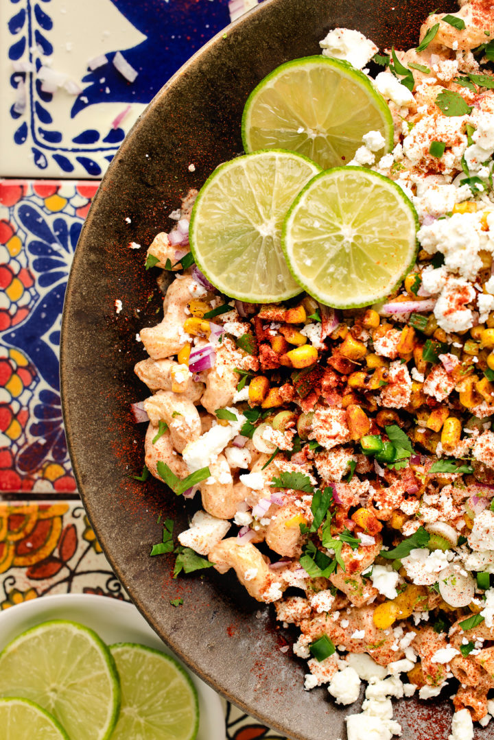 close up of a bowl of elote corn pasta salad