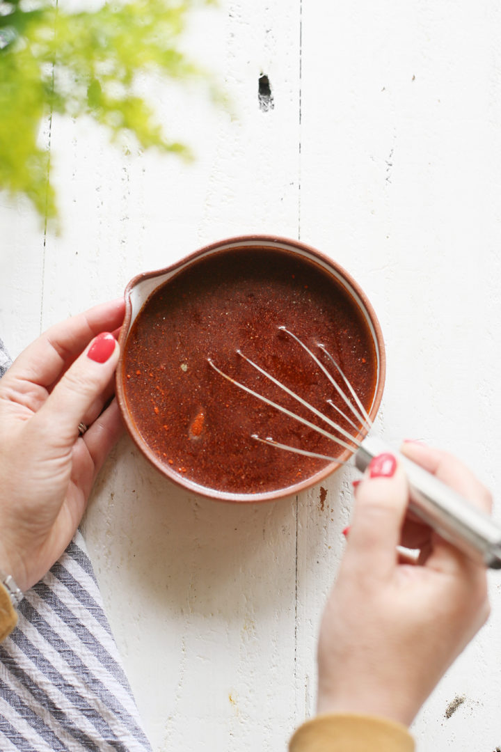 woman making marinade for bbq chicken