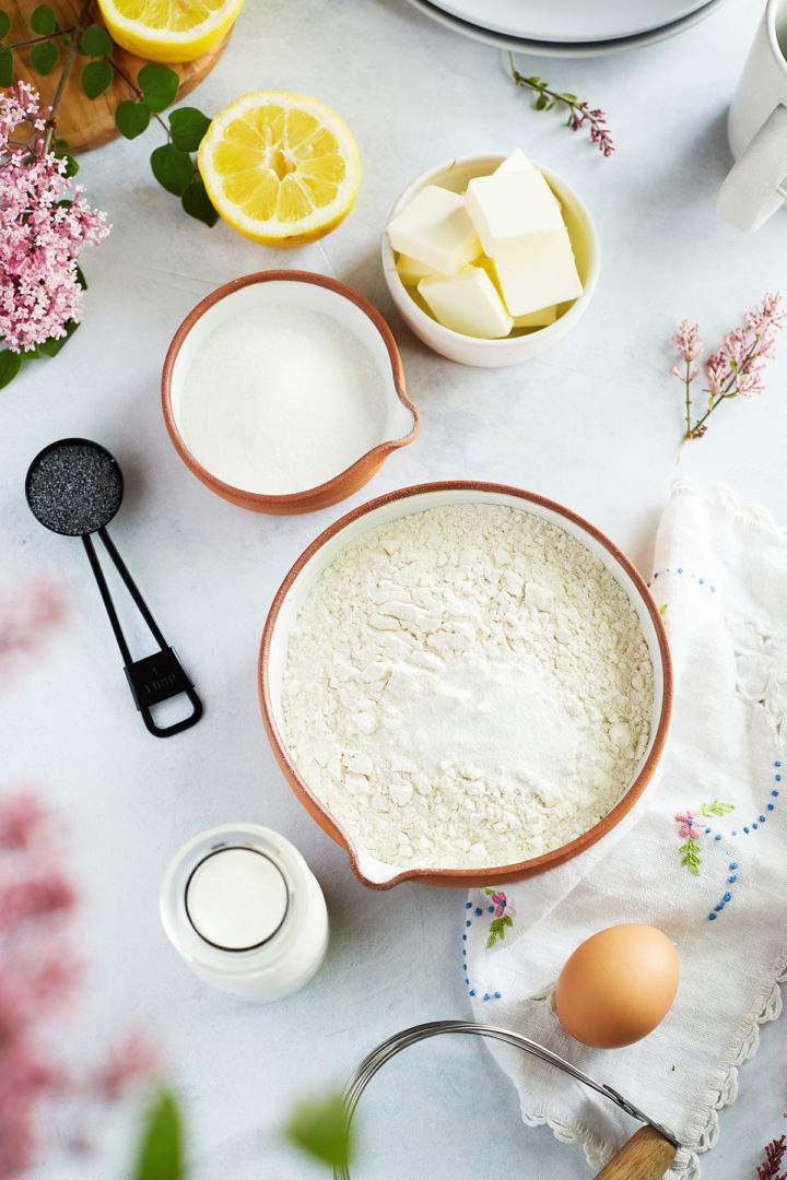 bowls of ingredients needed to make lemon poppyseed scones