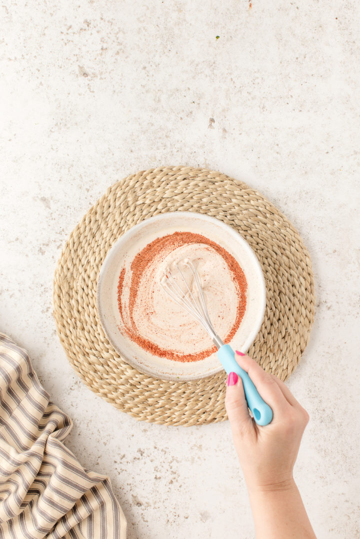 stirring the salad dressing