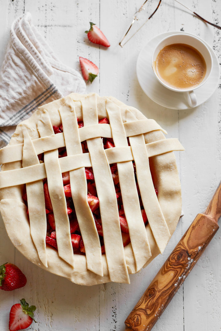 step 2 showing how to make a lattice crust top for a rhubarb strawberry pie recipe