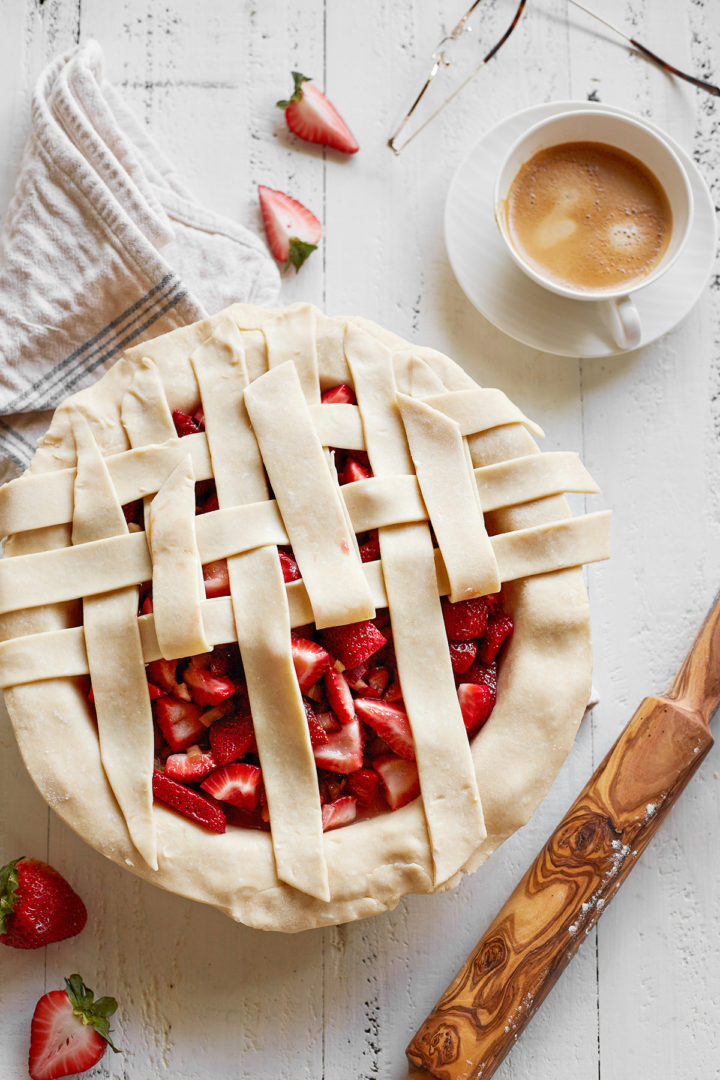 step 3showing how to make a lattice crust top for a strawberry and rhubarb pie