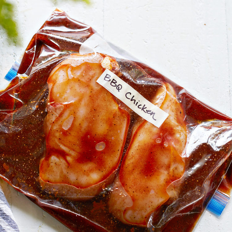 chicken breasts in a zip top bag with bbq chicken marinade