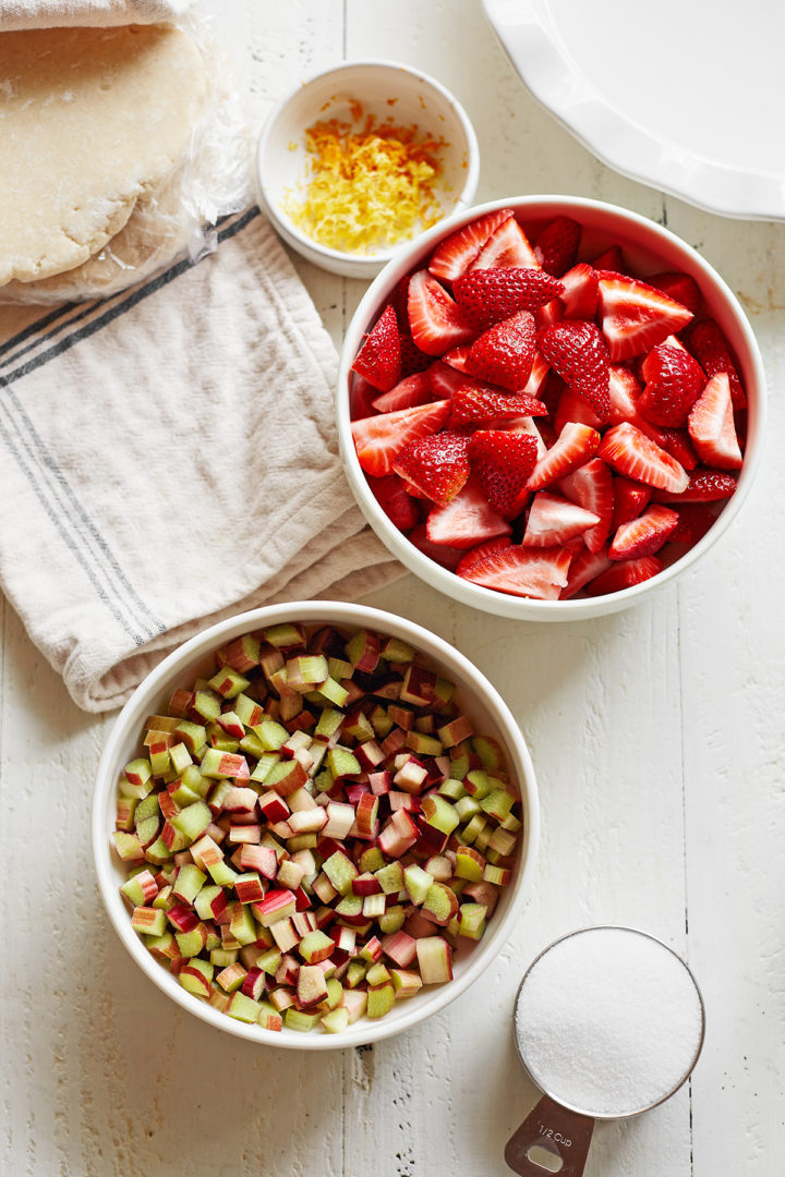 bowls of ingredients needed to make a strawberry rhubarb pie