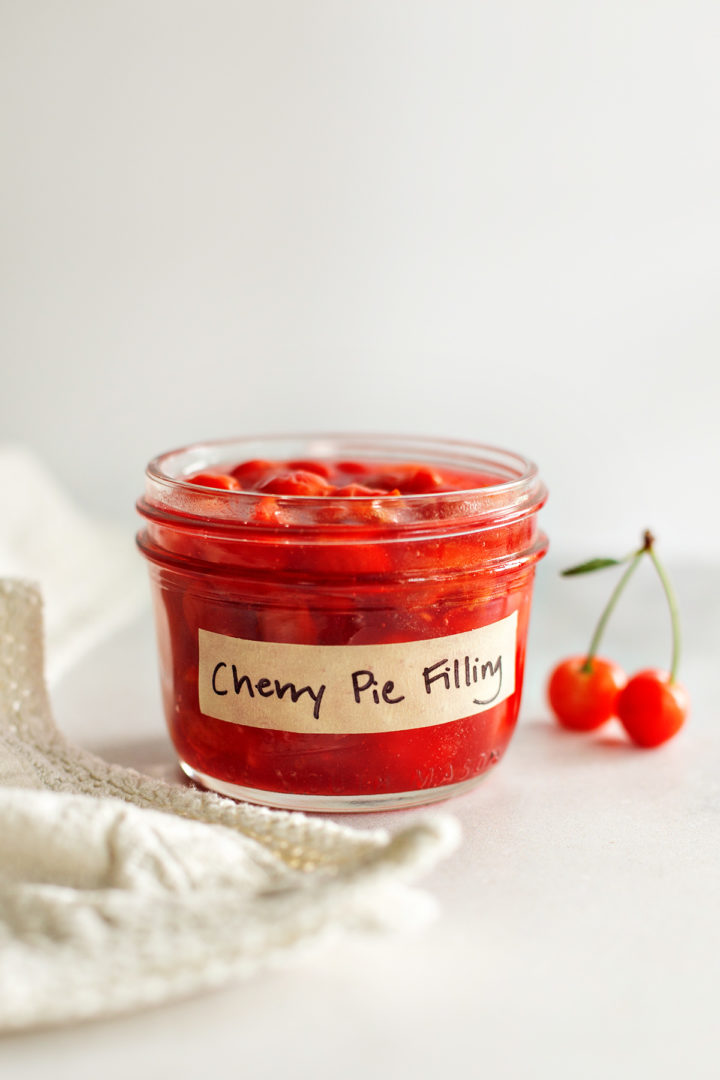 a jar of homemade cherry pie filling