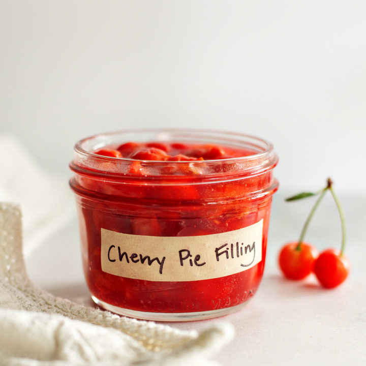 a jar of homemade cherry pie filling