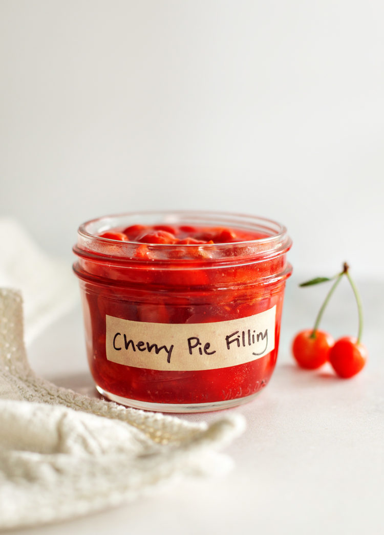 a jar of homemade cherry pie filling