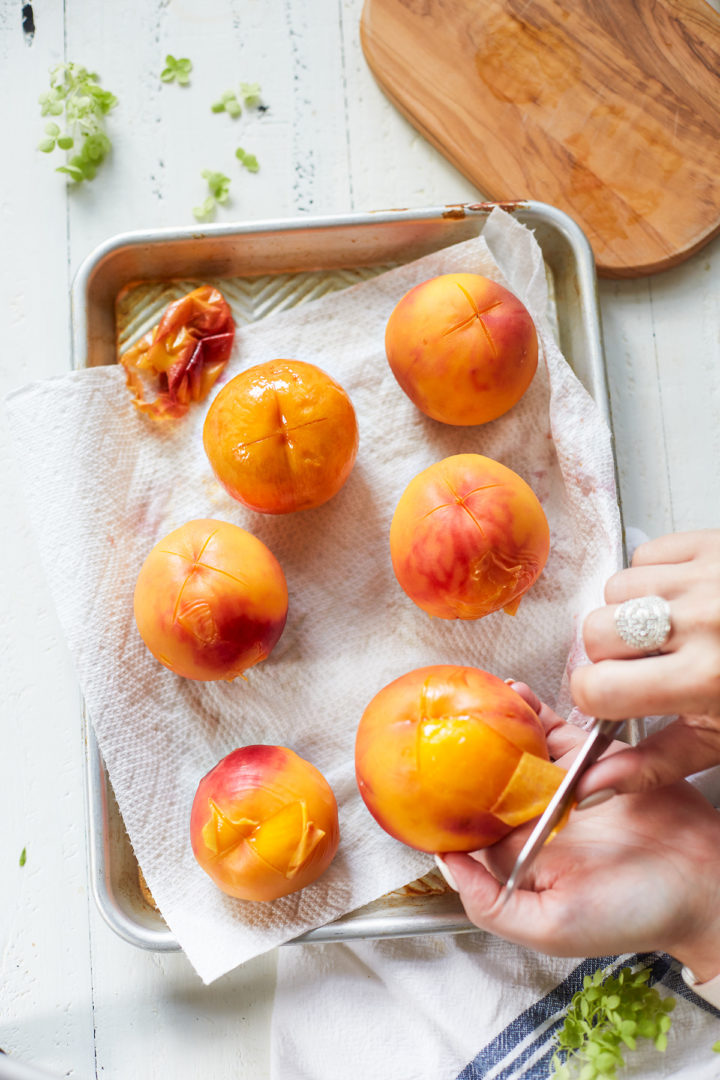 woman peeling peaches