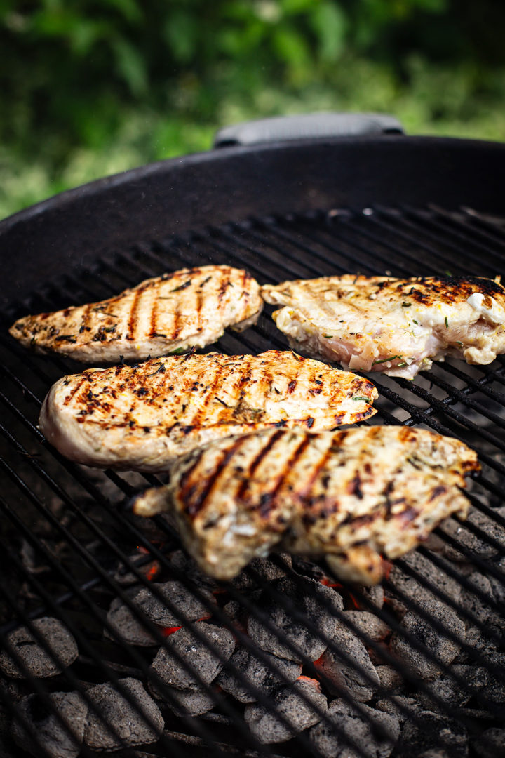 lemon and rosemary chicken cooking on the grill