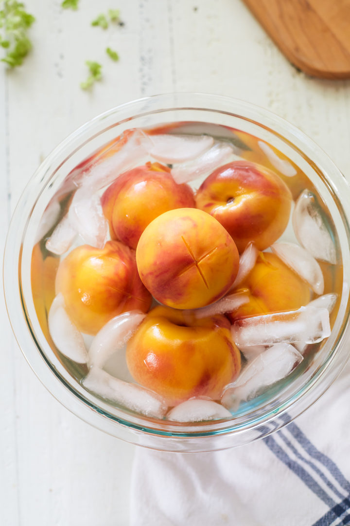 blanched peaches in an ice bath before peeling