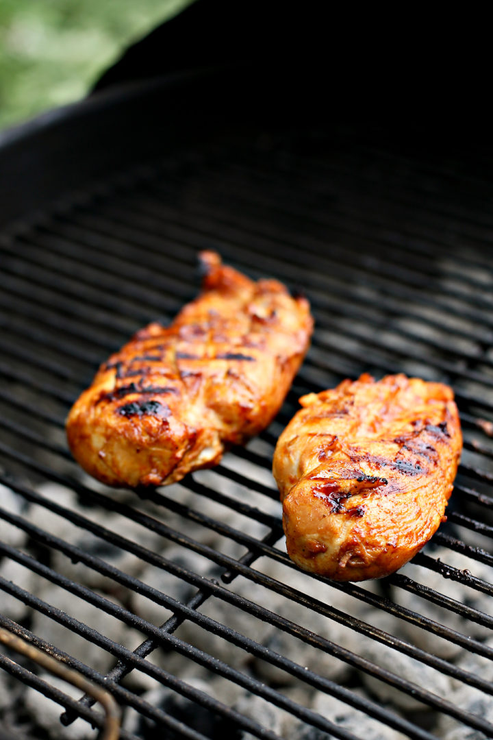 close up of bbq chicken on grill