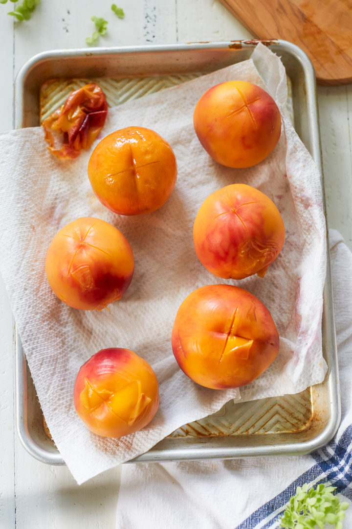 a tray of blanched peaches